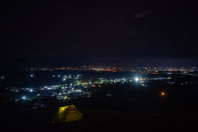 High angle view of illuminated city buildings at night