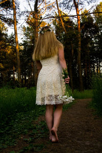 Rear view of woman walking in park