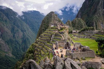 Tourists against mountains