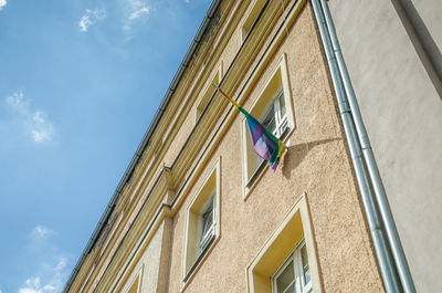 Low angle view of flags against sky