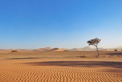 Scenic view of desert against clear sky