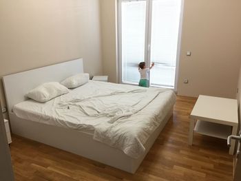 Rear view of child in bedroom