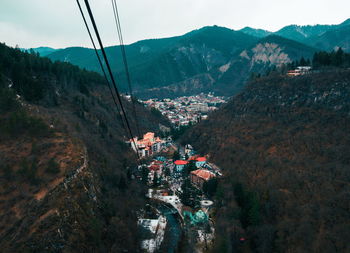 High angle view of buildings in town against sky