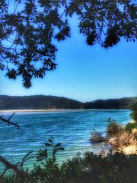 Scenic view of calm lake against clear sky