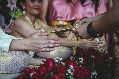 Close-up of couple holding hands