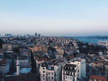 High angle view of cityscape against blue sky