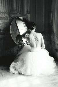 Rear view of young woman in wedding dress