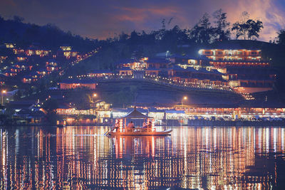 Illuminated buildings in city at night