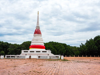 View of temple building against cloudy sky