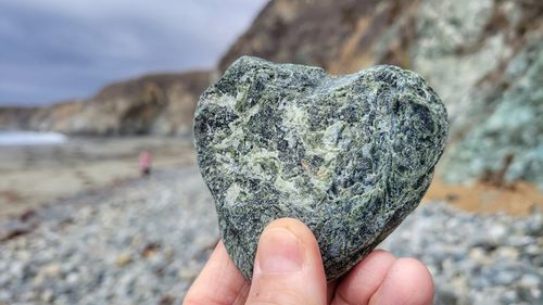 Close-up of hand holding rock