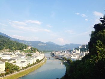 View of town against cloudy sky