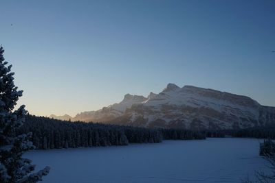 Scenic view of mountains against sky during winter