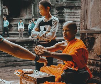 People standing outside temple