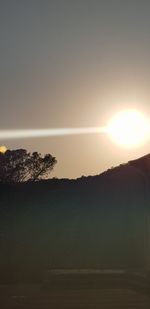 Scenic view of silhouette mountain against sky during sunset