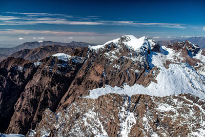 Scenic view of snowcapped mountains against sky during winter