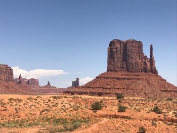 Rock formations in desert against clear sky