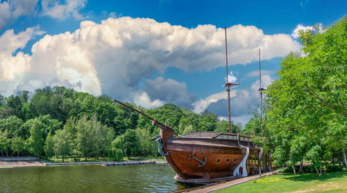 Panoramic view of sailboats moored on trees against sky