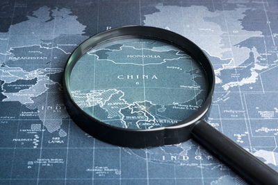 Close-up of magnifying glass on map