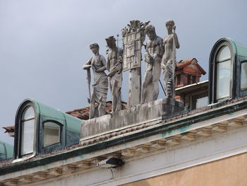 Low angle view of statue against sky