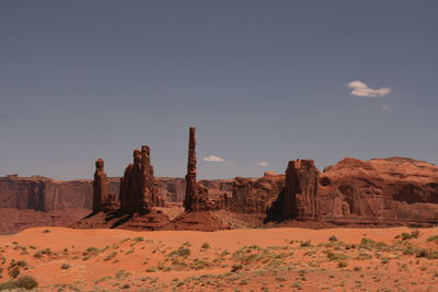 Rock formations at desert against sky