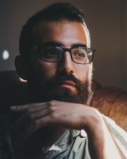 Close-up of bearded man at home