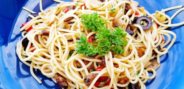 High angle view of noodles served in blue plate