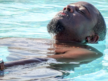 Man swimming in pool