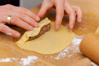 Midsection of person preparing food