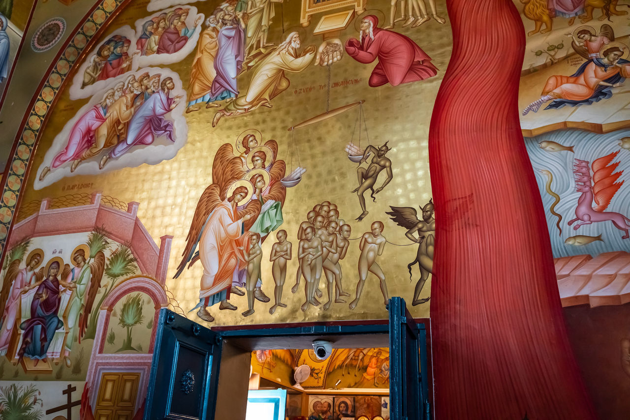 LOW ANGLE VIEW OF PAINTING ON WALL IN TEMPLE