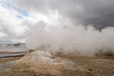 Scenic view of clouds over landscape against sky