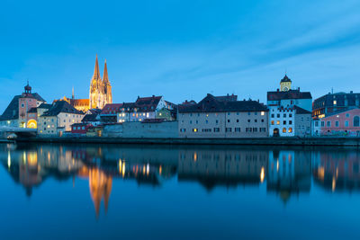 Reflection of illuminated buildings in city