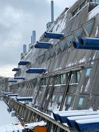 Low angle view of buildings in city against sky