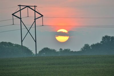 Scenic view of field against sky during sunset