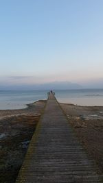 Pier over sea against sky