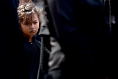 Close-up of girl standing at night