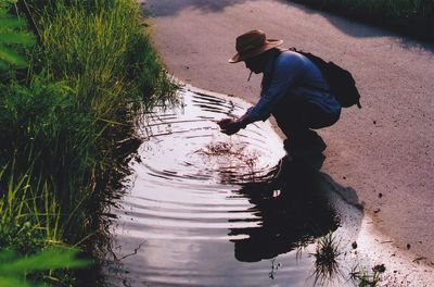 Side view of baby girl in lake