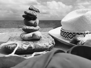 Close-up of pebbles and hat