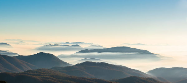 Scenic view of mountains against sky during sunset