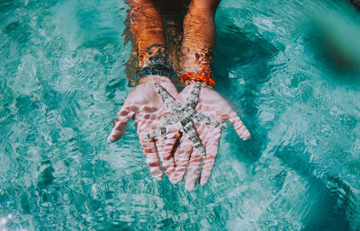 Low section of woman in swimming pool