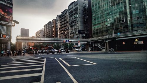 City street and buildings against sky