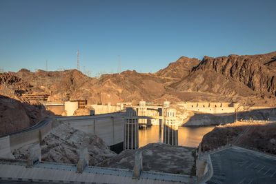 Scenic view of mountains against clear blue sky