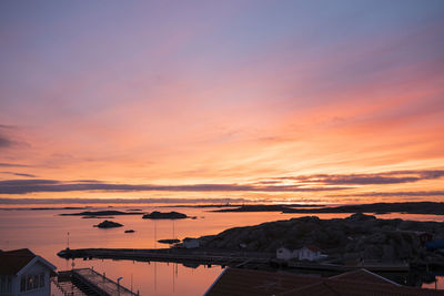 Scenic view of sea against orange sky