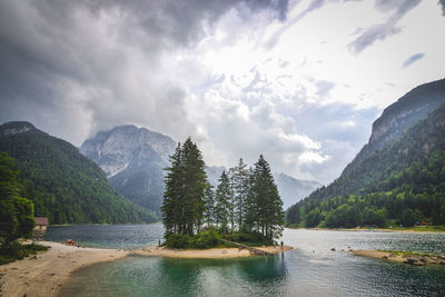 Scenic view of lake and mountains against sky