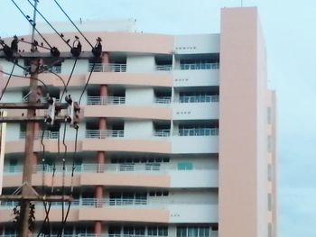 Low angle view of buildings in city against sky