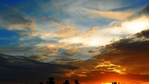 Low angle view of dramatic sky during sunset