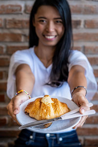 Portrait of woman holding ice cream