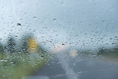 Rain drops on car windshield.