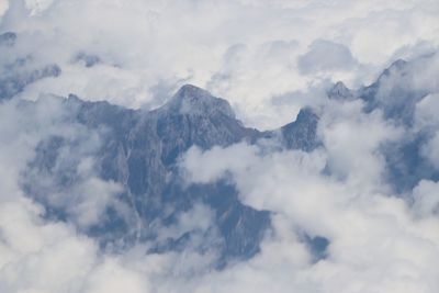 Low angle view of majestic mountains against sky