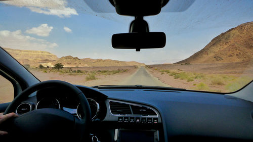 Cropped image of car on road