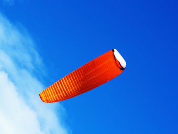 Low angle view of parachute against sky